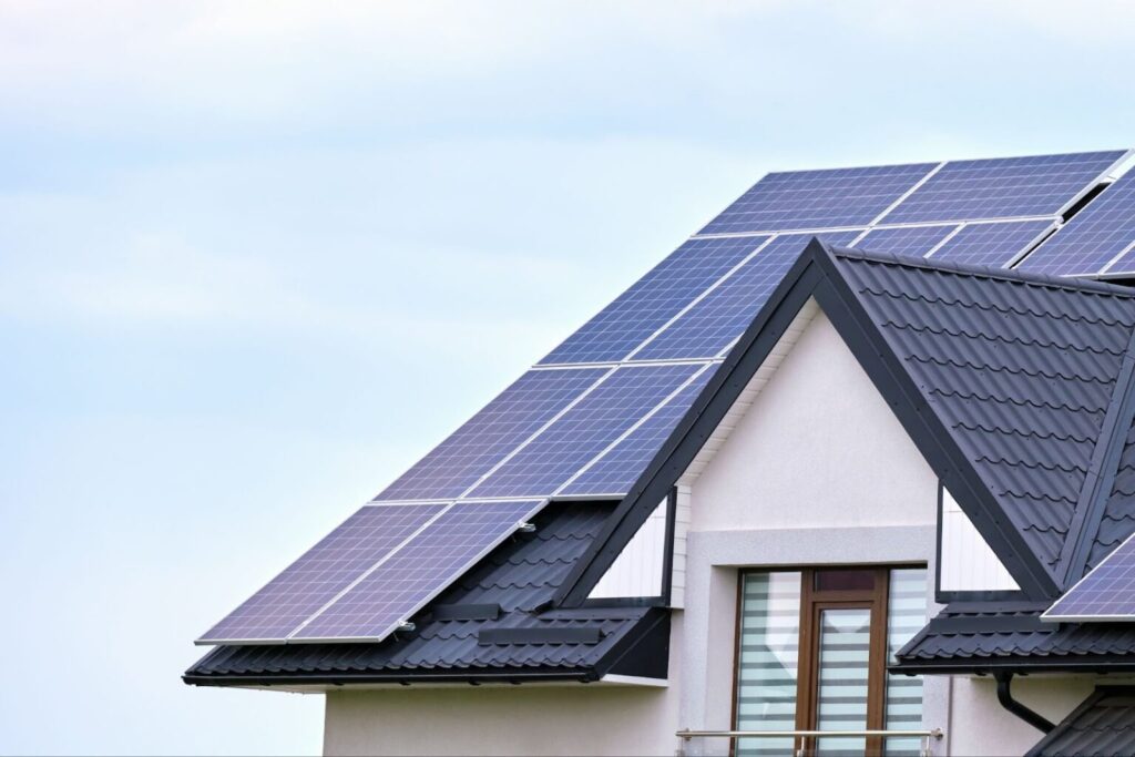 Residential house with rooftop covered with solar photovoltaic panels