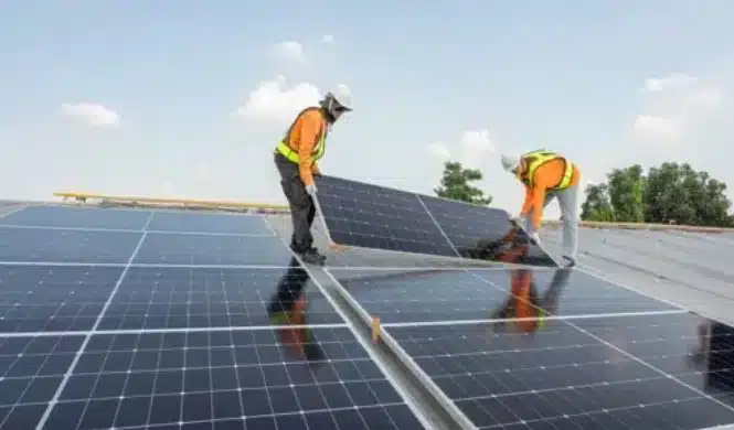 Solar panel installers on florida home rooftop